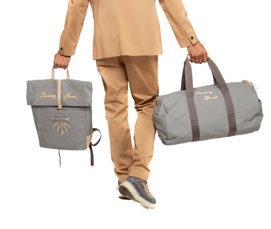 “LUXURY GOODS” Grey Canvas Duffle Bag