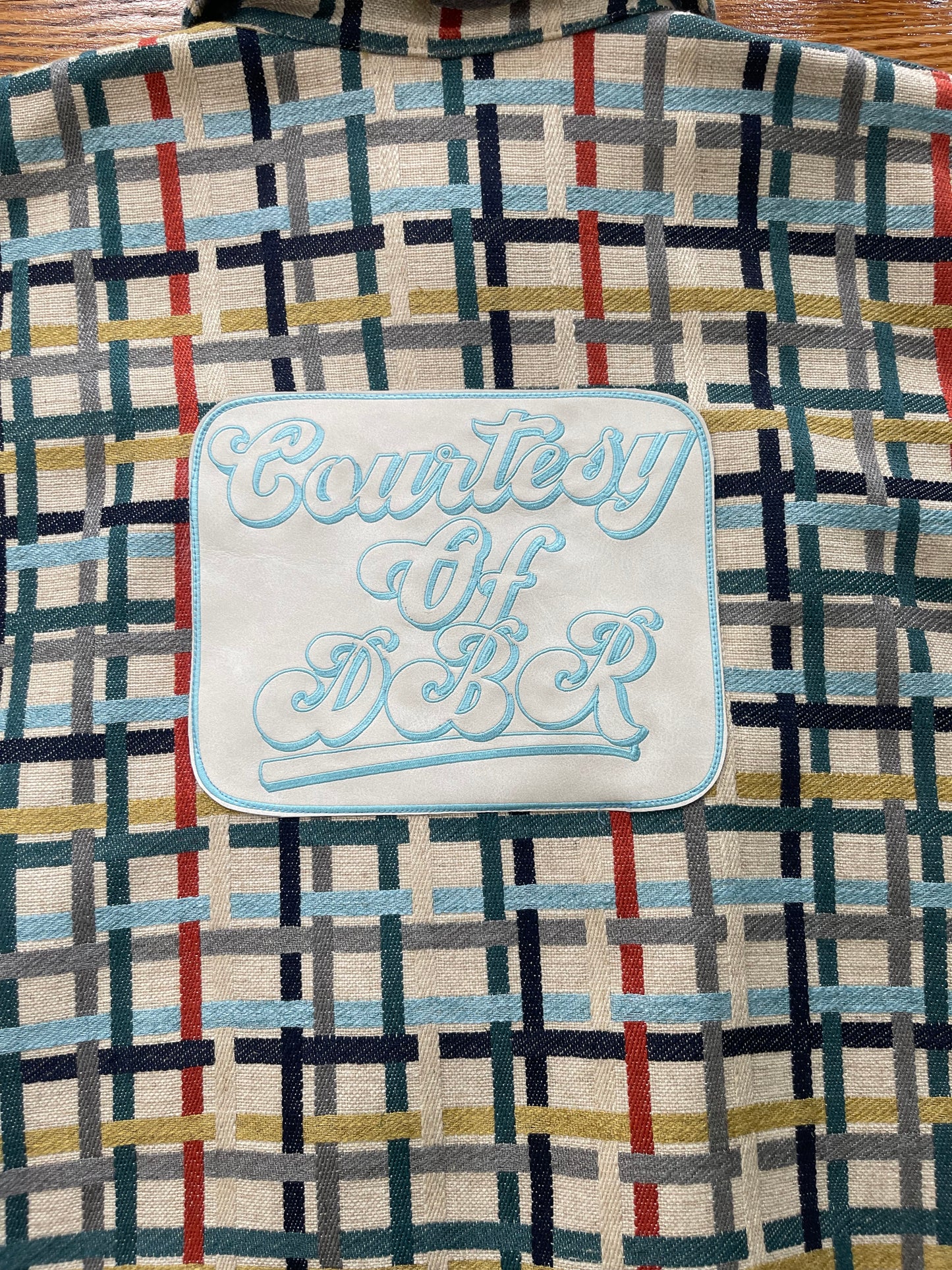 Multi colored jacket with DBR patch